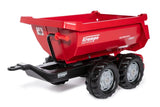 Red Rolly Halfpipe Krampe Trailer with twin axle wheels and a deep round tipped dump bed displayed on a clean white background.