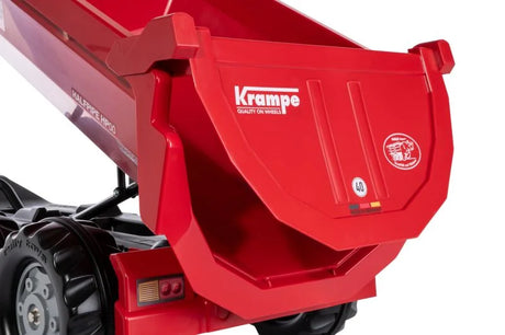 Red Rolly Halfpipe Krampe Trailer shown tipping its large round dump bed using the front handle on a white background.