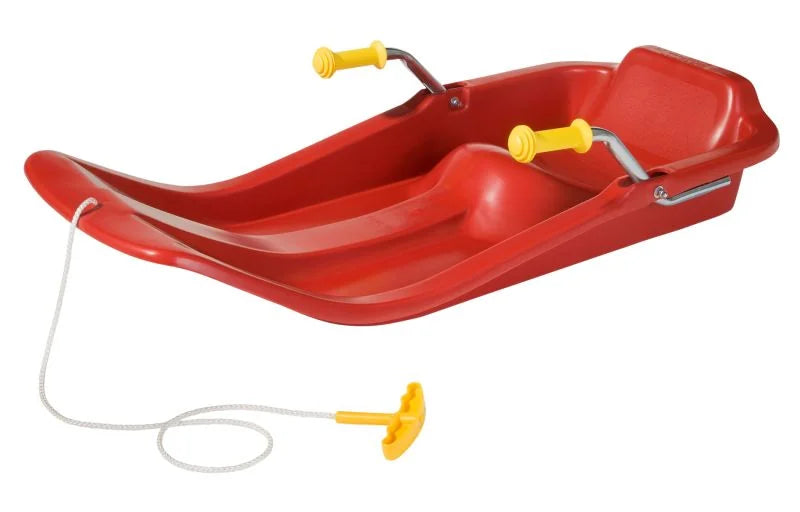 Side view of the red Rolly Jetstar snow sleigh showing the shaped seat, metal brake bars, and pull rope