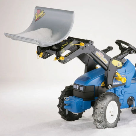 Rolly Snowmaster attachment mounted on a blue Rolly tractor lifting a grey snow plow blade filled with snow