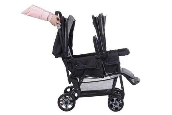 Safety 1st Teamy black tandem stroller folded in side view with wheels and handle visible