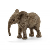 A side angle of an elephant calf figurine highlighting its sturdy legs, curved trunk, and detailed surface patterning.