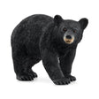 Schleich American Black Bear figure with a black textured coat, tan muzzle, brown eyes and visible claws.