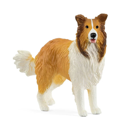 Schleich Collie figure with a long brown and white coat, upright ears, open mouth and raised bushy tail