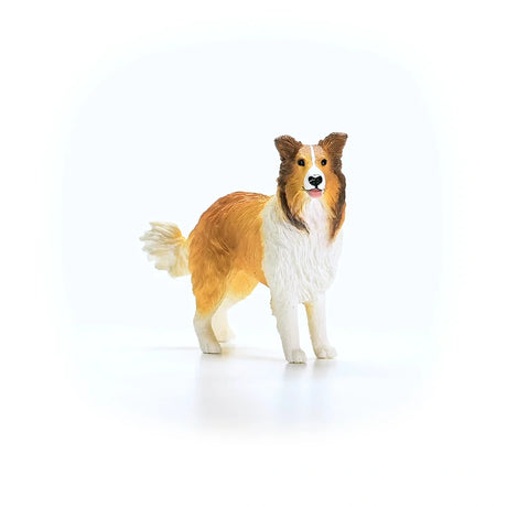 Schleich Collie figure facing slightly right with four white lower legs, brown facial markings and a raised tail 