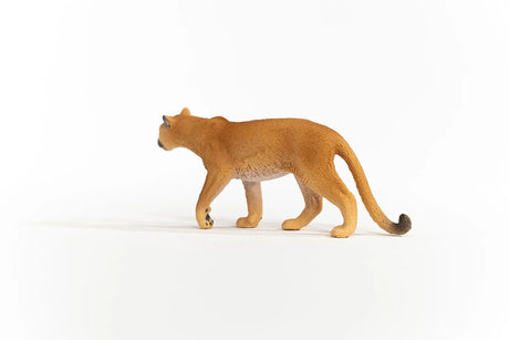 Schleich Cougar figure with a tan coat, pale belly, dark ear tips and a long curved tail with a dark tip.