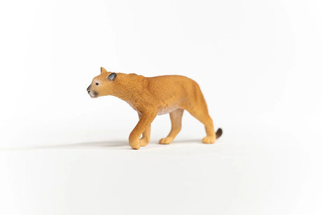 Schleich Cougar figure with a tan textured coat, pale underside, dark ear tips and one front paw raised.