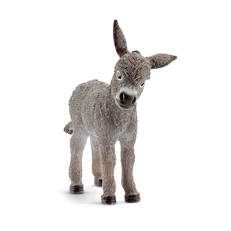 Schleich Donkey Foal figure facing forward with one ear upright, one ear angled sideways and a textured grey coat