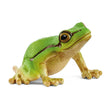 A green tree frog figurine with a rounded body, large dark eyes, and a dark stripe along its side.