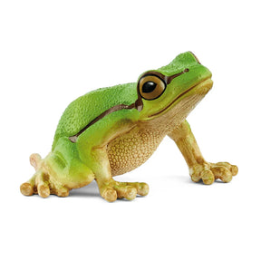 A green tree frog figurine with a rounded body, large dark eyes, and a dark stripe along its side.