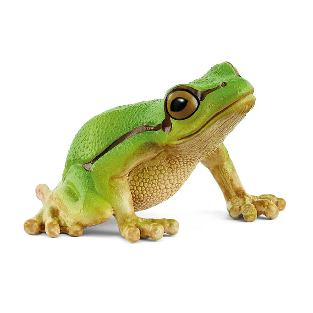 A green tree frog figurine with a rounded body, large dark eyes, and a dark stripe along its side.