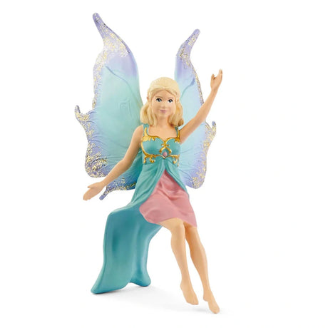 Schleich fairy figure in a seated pose with blonde hair, a turquoise and pink dress, and large blue and purple wings