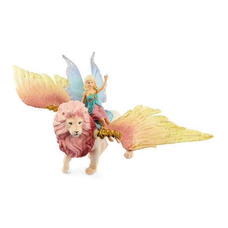 Front view of the Schleich fairy riding the winged lion with both pink and gold wings spread wide