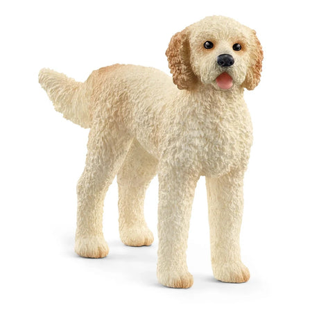 Schleich Goldendoodle figure with a curly cream coat, black nose, dark eyes and an open mouth with a pink tongue