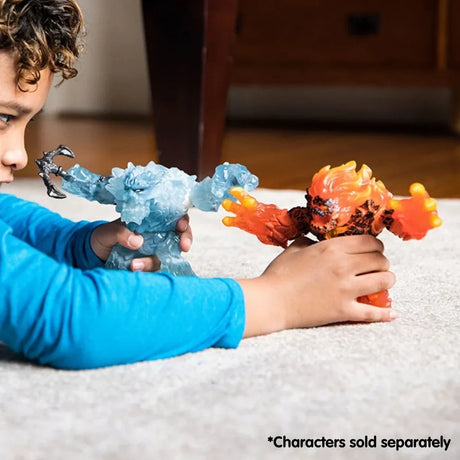 Child holding the Schleich Ice Giant and Lava Smasher figures facing each other on a carpet