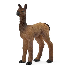 Schleich llama foal figure standing upright with textured brown fleece, dark ears and a gentle expression.