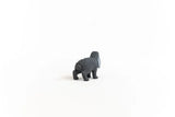 Rear view of the Schleich Lop-Eared Rabbit figure showing its rounded tail, textured grey coat and back legs