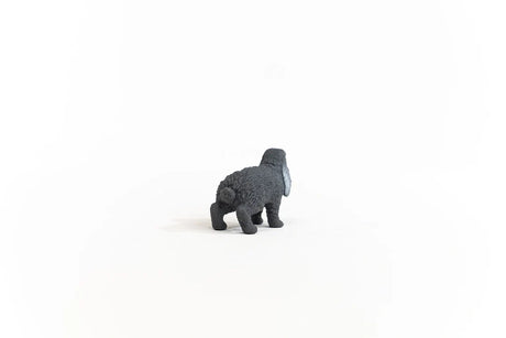 Rear view of the Schleich Lop-Eared Rabbit figure showing its rounded tail, textured grey coat and back legs