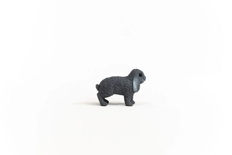 Schleich Lop-Eared Rabbit figure shown from the right side with one black eye, long hanging ears and a short tail