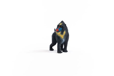 Schleich Mandrill figure standing with yellow chest colouring, a red muzzle and blue facial markings.