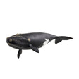 Schleich North Atlantic Right Whale figure in left side view with textured markings on its head and a white patch near the tail