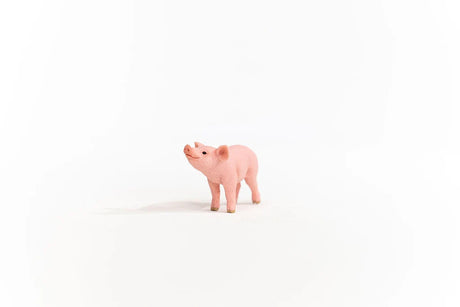 Schleich Piglet figure standing in a front three-quarter view with its head raised.