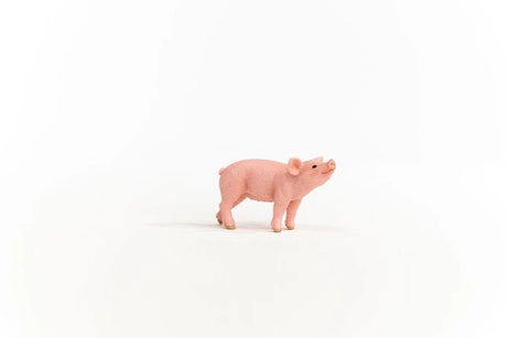 Schleich Piglet figure in profile with its snout pointing upwards and all four legs visible.