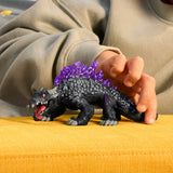 Child playing with Schleich Shadow Lizard 70840