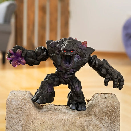 Schleich Shadow Stone Monster figure standing on a stone block with its mouth open and purple crystal fist extended