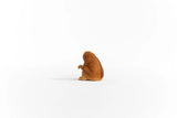 Schleich Slow Loris figure shown from the rear left with brown textured fur and one arm raised.