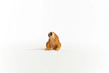 Schleich Slow Loris figure seated with its head turned left, dark eye markings and both feet visible.