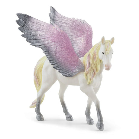 Schleich Sunrise Pegasus figure showing its silver hooves, white body, raised wings and pastel yellow and pink tail
