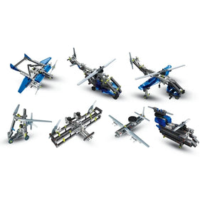 Six assembled aeroplane and helicopter construction models in blue, grey, black and white.