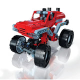 Red monster truck model with four large black wheels, grey frame pieces and a raised cab.