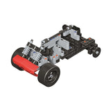 Science Museum Mechanics Ultimate Racer construction stage with rear wheels, spring details and exposed grey and black chassis parts.