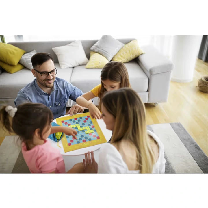 Scrabble Junior game being played by a family around the board