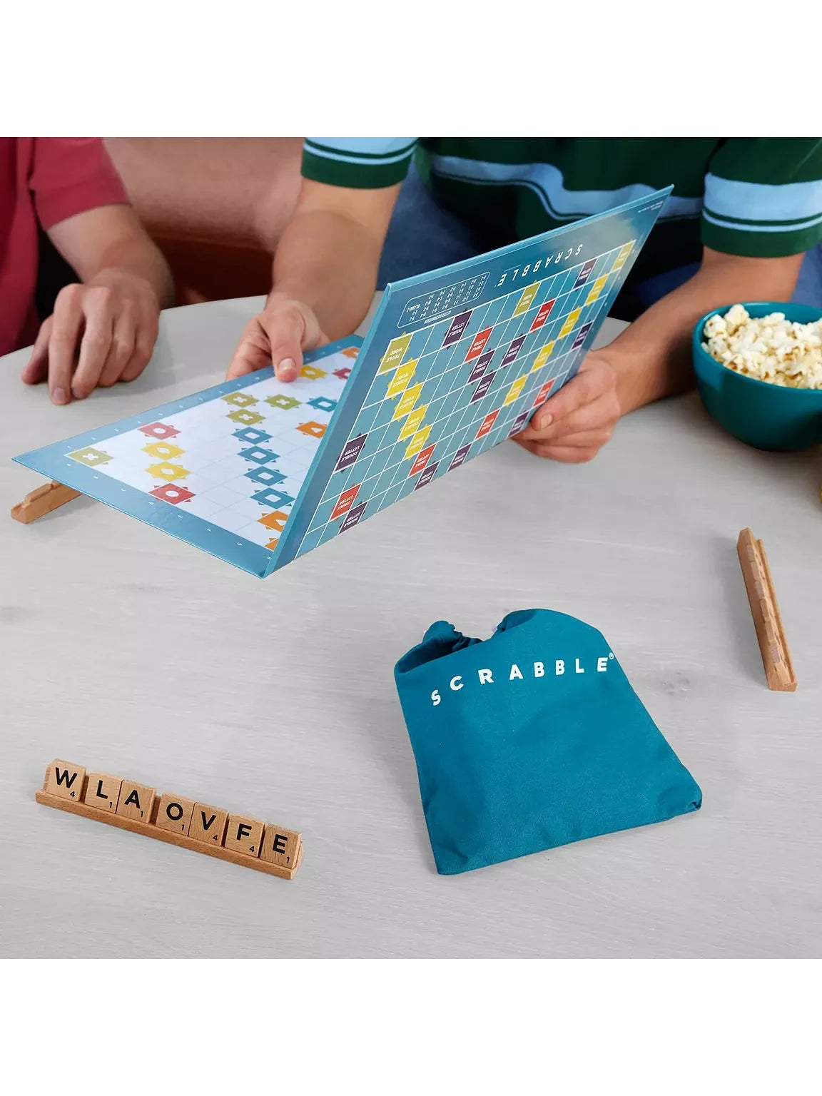 Scrabble Two Games in One board standing upright with tiles, rack and tile bag beside it
