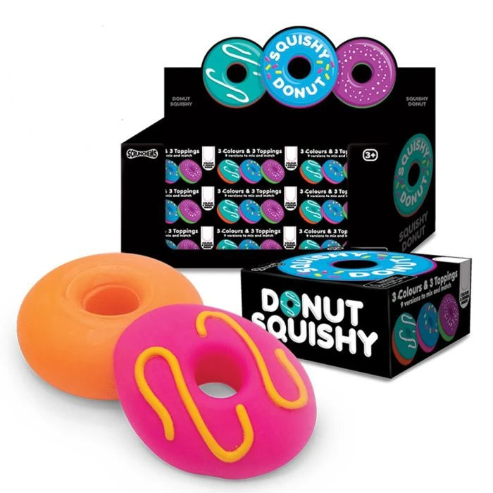 Scrunchems Donut Squishy pink icing and orange donut beside the retail display box showing the assorted designs
