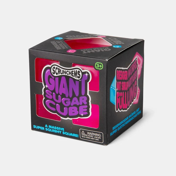 Scrunchems Giant Squishy Sugar Cube in black retail packaging with pink and blue cube designs