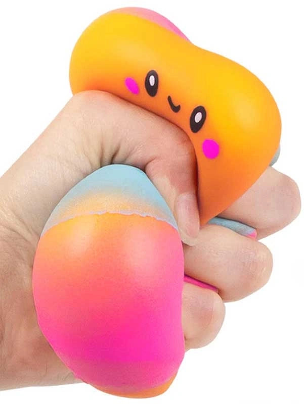 Scrunchems Marshmallow Squishy squeezed in one hand showing the soft foam texture