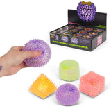 Scrunchems Sensory Sugar Shapes assortment with display box, coloured shapes and squeezed purple ball