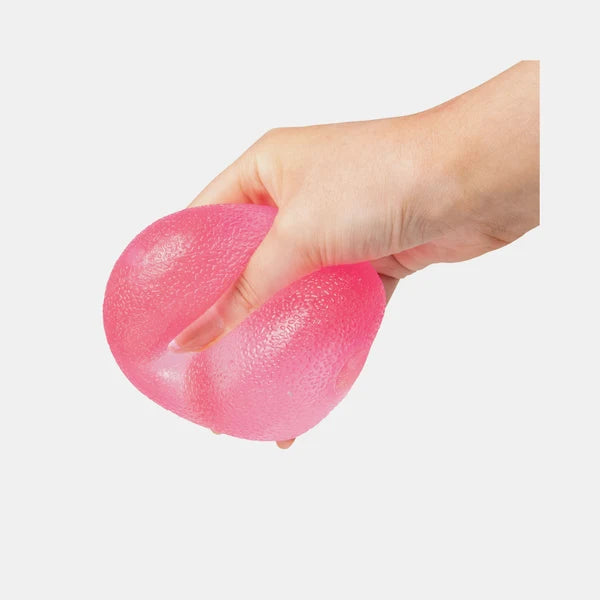 Pink Scrunchems Squishy Sugar Drop being squeezed firmly in a hand
