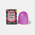 Purple Scrunchems Squishy Sugar Drop beside its individual black retail box