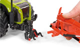 Siku 1:32 maize leveller farm toy shown connecting to a tractor rear hitch