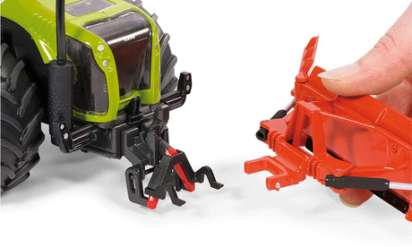 Siku 1:32 maize leveller farm toy shown connecting to a tractor rear hitch