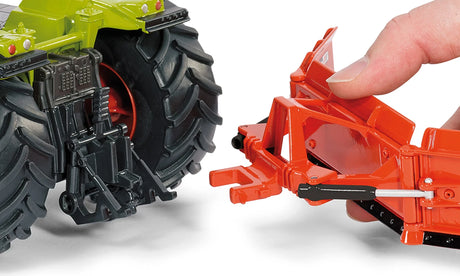 Siku 1:32 maize leveller farm toy shown connecting to a tractor rear hitch