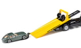 Siku MAN ADAC Breakdown Truck 2722 with the yellow recovery platform lowered into a ramp and the green car positioned for loading