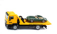 Siku MAN ADAC Breakdown Truck 2722 in side view carrying the included green car on the yellow recovery platform