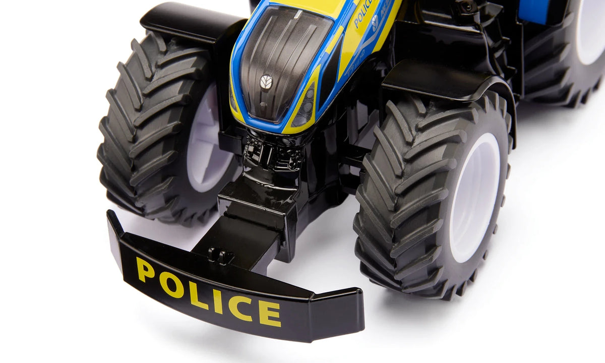 Front view of the Siku New Holland Police Tractor 3297 showing the removable black Police front weight mounted ahead of the front wheels