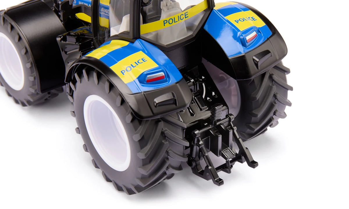 Close rear view of the Siku New Holland Police Tractor 3297 showing the rear linkage, Police marked mudguards and twin rear tyres
